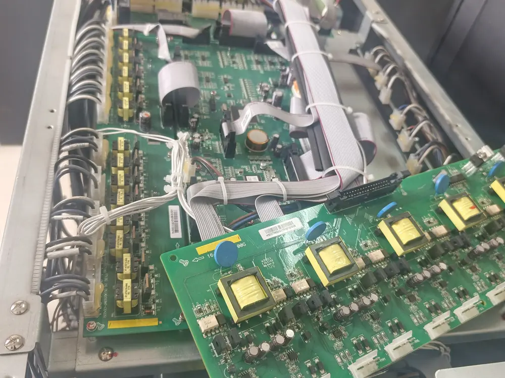 Open UPS cabinet during repair, showing power and control boards